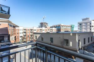a view of a city from a balcony at Mint House Greenville Downtown By Kasa in Greenville