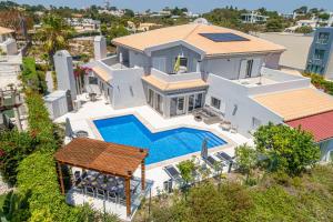 an aerial view of a house with a swimming pool at Villa Atlantica in Setúbal