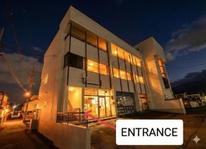a building with the words entrance in front of it at -Ina Stay Central Hotel-8名宿泊可 伊那市駅徒歩5分 駐車場無料 a sleep8-a 5minute walk from the station-Free parking in Ina