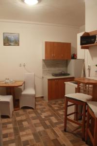 a small kitchen with a table and a table and chairs at Lucka in Ústí nad Labem