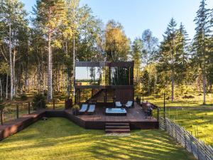 a glass house in the middle of a yard at Luxury Resort Kabuna in Kabuna