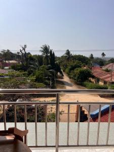 a view of a road from a balcony at PhyllenHotel Tanga in Tanga