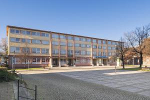 a large building in the middle of a street at Hotel Veronika in Ostrava