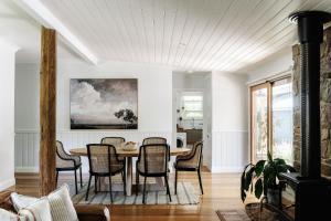 a dining room with a table and chairs at Corner Cottage Bright in Bright