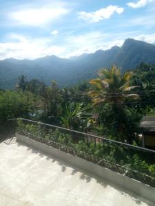a view of the mountains from the balcony of a house at Arhh castle in Ginigathena