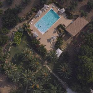 an overhead view of a resort with a swimming pool at Agriturismo Baglio Vecchio in Castelvetrano Selinunte +77 photos