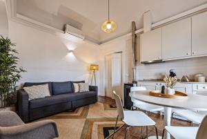 a living room with a couch and a table at Casa Soure Suites and Apartments in Évora