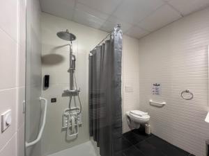 a bathroom with a shower and a toilet in it at SQUARE HOTEL in Nîmes +103 photos