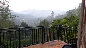 a balcony with a view of the mountains at AnuBi Nest Ella in Ella