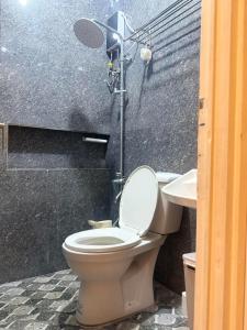 a bathroom with a toilet and a sink at Homestay in Lipa City in Lipa