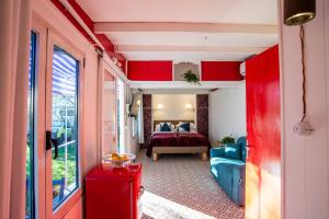 a room with a bedroom with a bed and a couch at Atelier Randagi al Pigneto 1&2 in Rome +27 photos