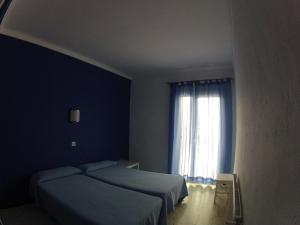 Postel nebo postele na pokoji v ubytování Hostal German