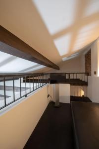 a view from the top floor of a building with a balcony at Suite Apartments by Hotel Gabbani in Lugano +7 photos