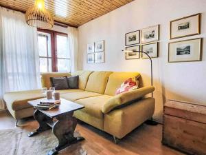 a living room with a couch and a table at Apartment Aragon B48 by Interhome in Ernen +80 photos