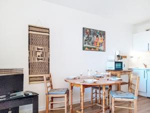 a kitchen with a table and chairs in a room at Apartment Horizon Marin-2 by Interhome in Lacanau-Océan