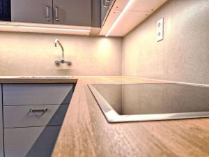 a kitchen with a sink and a counter top at Holiday Home Ötztal by Interhome in Oetz
