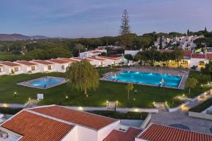 an aerial view of a resort with two pools at Hotel Apartamento Do Golfe in Vilamoura