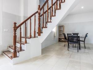 a dining room with a table and a staircase at Holiday Home Del Sol by Interhome in Salou +24 photos