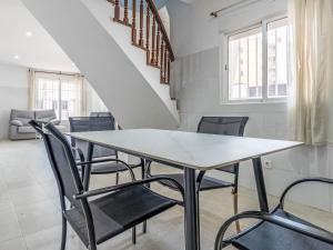 a dining room with a table and chairs at Holiday Home Del Sol by Interhome in Salou
