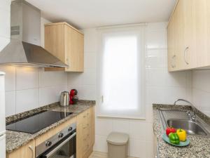 a kitchen with a sink and a counter top at Apartment Mitsu by Interhome in Tossa de Mar