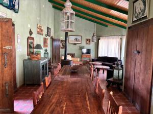 a living room with a couch and a table and chairs at Cortijo Zalamea in Zalamea la Real
