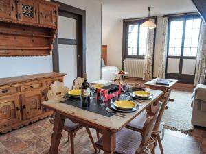 a dining room with a wooden table and chairs at Apartment Plan Névé 5 by Interhome in Villars-sur-Ollon