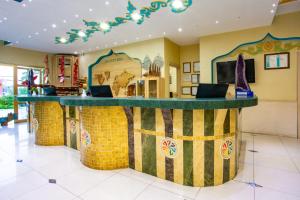 a bar in a restaurant with a counter in a room at Daima Biz Hotel - Dolusu Aquapark Access in Kemer +60 photos
