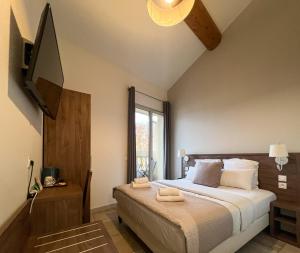 a bedroom with a bed with two towels on it at SQUARE HOTEL in Nîmes