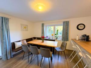 a dining room with a wooden table and chairs at Apartment Benjamin by Interhome in Hollersbach im Pinzgau +44 photos