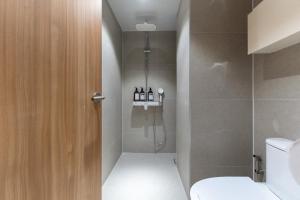 a bathroom with a shower and a toilet at akastay Myeongdong in Seoul +62 photos