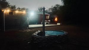 a night time picture of a hot tub in a yard at Desert Bloom Cottage in Buffelskloof