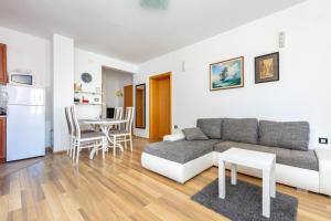 a living room with a couch and a table at Apartment Vidak in Vantačići