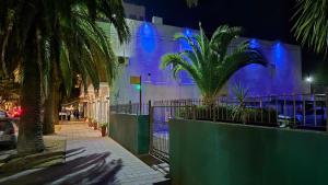 a building with blue lights on the side of it at Continental Hotel in Miramar