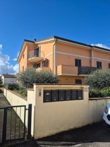 a building with a fence in front of it at House Barbanera in Spello
