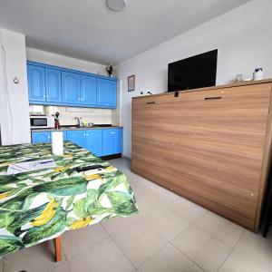 a bedroom with a large entertainment center with a television at Hilo Verde in Matalascañas
