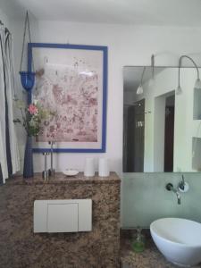 a bathroom with a sink and a mirror at Ferienwohnung Bitterling in Marktschellenberg +21 photos
