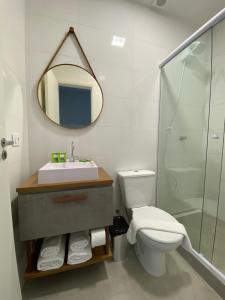 a bathroom with a sink and a toilet and a mirror at NOBRE HOTEL COTIA in Cotia +26 photos