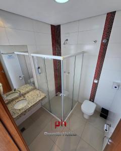 a bathroom with a glass shower and a toilet at Barueri Premiêr Hotel in Barueri +38 photos