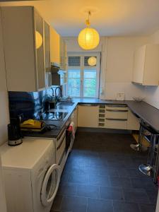 a kitchen with a sink and a stove top oven at Stadtmitte Ferienwohnung in Darmstadt