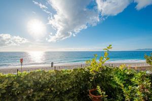 a view of the beach and the ocean at SEAHORSEROOM - Frontemare con Idromassaggio in Finale Ligure