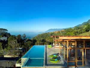 a view of a house with a swimming pool at Wishing Tree Boutique Resort and Spa - Haputale's Panoramic Hideaway in Haputale