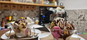 two bowls of ice creaminis sitting on a table at Guest House Čater in Laško