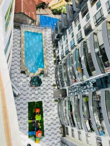 an overhead view of a building with a swimming pool at Diamond Oark Residency in Gatunga