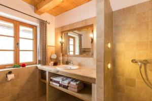 a bathroom with a sink and a mirror at Schauerhof in Chieming +79 photos