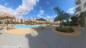 a resort with a swimming pool and some buildings at Casa Sole Sharm Hills Apt 4 in Sharm El Sheikh