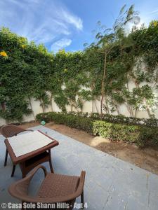 a patio with two chairs and a table at Casa Sole Sharm Hills Apt 4 in Sharm El Sheikh