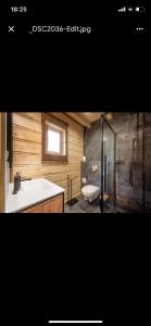 a bathroom with a tub and a sink and a toilet at Pod Brzozka in Cisna +62 photos
