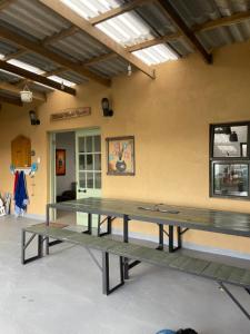 a ping pong room with two ping pong tables at Jabula Beach House in Mngazana