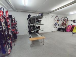 a bike garage with a rack of bikes at Apartment Keller in Savognin