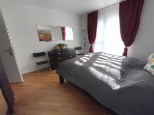 a bedroom with a bed and a window at Apartment Keller in Savognin